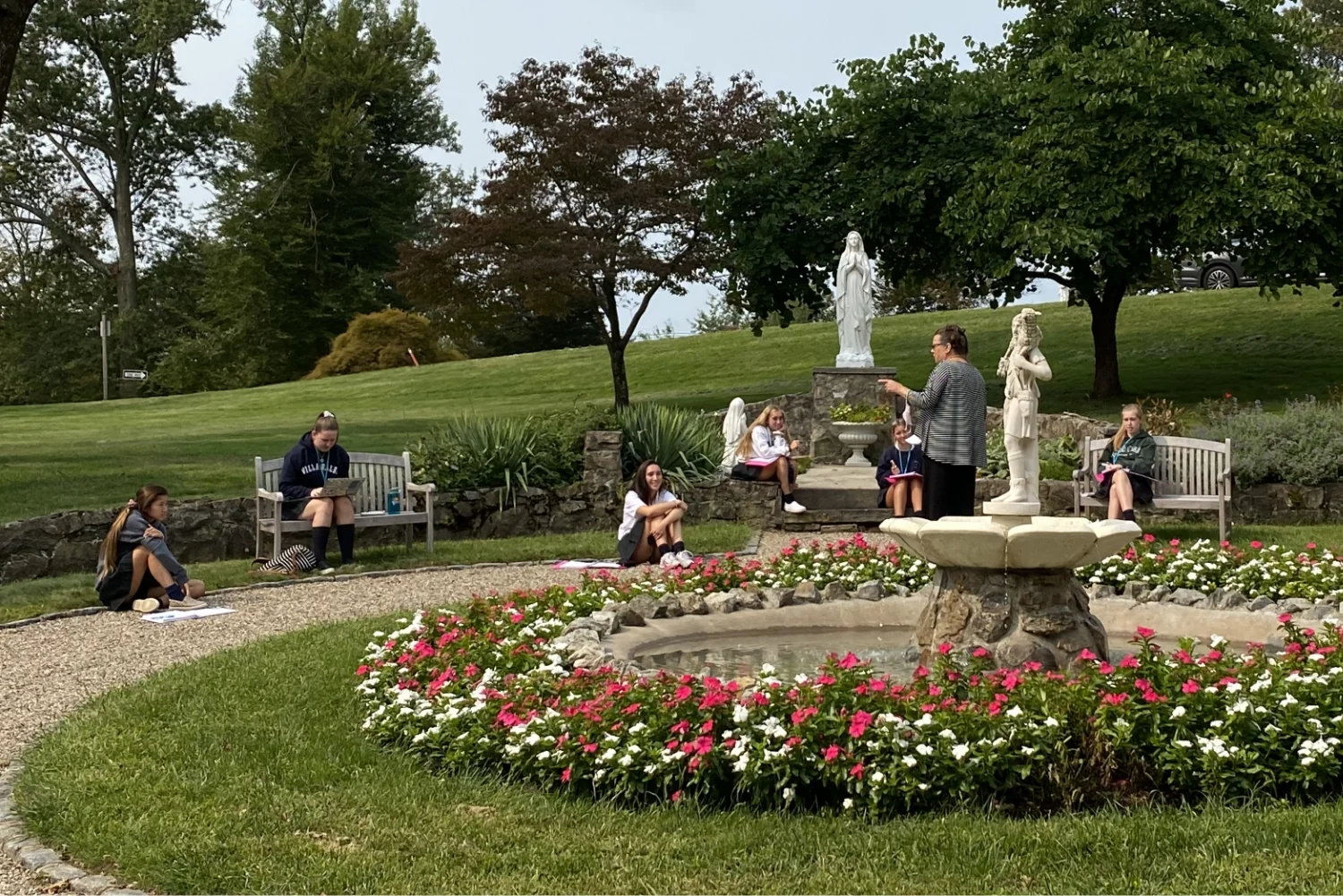 students in VWA campus garden